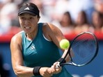 Jessica Pegula of the United States, hits a return to Iga Swiatek of Poland, during the semifinals of the National Bank Open women’s tennis tournament