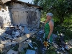 Lyubov Tolchina, 63, reacts next to the damaged house of her son Vitaly, 40, who was killed the day before by shelling in the course of Russia-Ukraine conflict in Donetsk, Russian-controlled Ukraine, August 13.