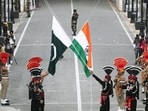 Pakistani Rangers and Indian Border Security Force (BSF) personnel lower their national flags during a parade on Pakistan's Independence Day, at the Pakistan-India joint check-post at Wagah border. Pakistani Rangers and Indian Border Security Force (BSF) personnel lower their national flags during a parade on Pakistan's Independence Day, at the Pakistan-India joint check-post at Wagah border.