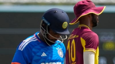 West Indies' Romario Shepherd celebrates the dismissal of India's Sanju Samson (AP)