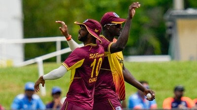 Roston Chase and Jason Holder celebrate the dismissal of Hardik Pandya during the fifth T20I at Central Broward Regional Park in Lauderhill (AP) Roston Chase and Jason Holder celebrate the dismissal of Hardik Pandya during the fifth T20I at Central Broward Regional Park in Lauderhill (AP)