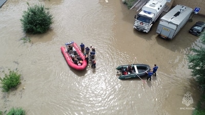 Typhoon Khanun in Russia: Rescuers use inflatable boats to evacuate residents of the area flooded due to a dam break in Ussuriysk, Russia. (Reuters)