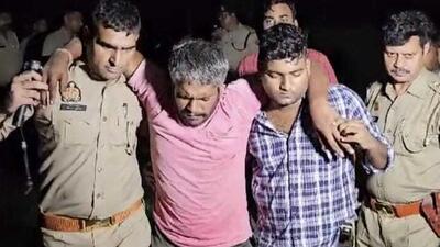 Amit Kumar (centre) in police custody after a gunfight. (HT Photo) Amit Kumar (centre) in police custody after a gunfight. (HT Photo)