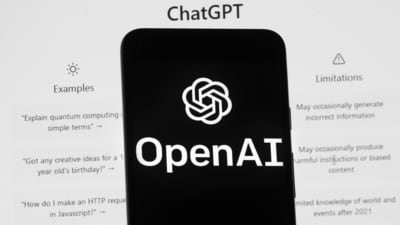 The OpenAI logo is seen on a mobile phone in front of a computer screen which displays the ChatGPT home Screen. The draft bill is not final and lawyers say it will likely take years to come into force. (AP) The OpenAI logo is seen on a mobile phone in front of a computer screen which displays the ChatGPT home Screen. The draft bill is not final and lawyers say it will likely take years to come into force. (AP)