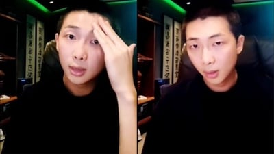 BTS' RM sported a black T-shirt as he spoke with his fans. BTS' RM sported a black T-shirt as he spoke with his fans.