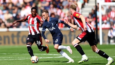 Tottenham Hotspur's James Maddison in action with Brentford's Shandon Baptiste. (REUTERS)