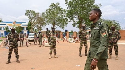Nigerien soldiers stand guard as supporters of Niger's National Council for the Safeguard of the Homeland (CNSP) gather for a demonstration in Niamey on August 11, 2023 near a French airbase in Niger. (AFP) Nigerien soldiers stand guard as supporters of Niger's National Council for the Safeguard of the Homeland (CNSP) gather for a demonstration in Niamey on August 11, 2023 near a French airbase in Niger. (AFP)