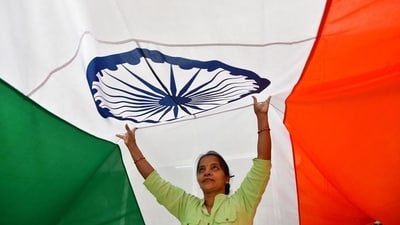 Workers give finishing touches to an Indian flag at a workshop ahead of the Republic Day, in Mumbai on Wednesday. (HT PHOTO) Workers give finishing touches to an Indian flag at a workshop ahead of the Republic Day, in Mumbai on Wednesday. (HT PHOTO)