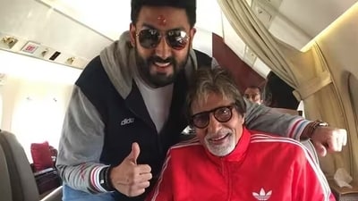 Abhishek Bachchan with father Amitabh Bachchan on a flight. Abhishek Bachchan with father Amitabh Bachchan on a flight.