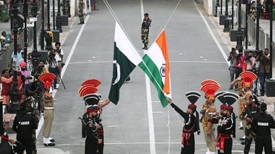 Pakistani Rangers and Indian Border Security Force (BSF) personnel lower their national flags during a parade on Pakistan's Independence Day, at the Pakistan-India joint check-post at Wagah border. (Reuters file photo for representation) Pakistani Rangers and Indian Border Security Force (BSF) personnel lower their national flags during a parade on Pakistan's Independence Day, at the Pakistan-India joint check-post at Wagah border. (Reuters file photo for representation)