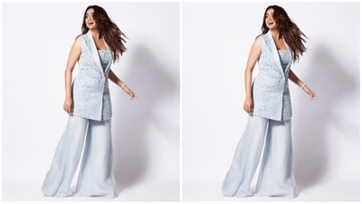 Her blazer set comes in a sky blue colour and is made of organza fabric, with her blazer featuring a lapel collar, a fitted bust and floral embellishments all over. She teamed it with a matching chanderi top and trousers. (Instagram/@keerthysureshofficial)