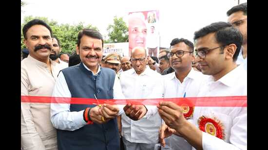 Nationalist Congress Party (NCP) chief Sharad Pawar and Deputy CM Devendra Fadnavis at an event in Solapur on Sunday. (HT PHOTO)