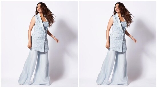 Her blazer set comes in a sky blue colour and is made of organza fabric, with her blazer featuring a lapel collar, a fitted bust and floral embellishments all over. She teamed it with a matching chanderi top and trousers.(Instagram/@keerthysureshofficial)
