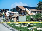 Investigators remain at the scene of a home explosion which occurred the day before on Rustic Ridge Drive in Plum, Pa., Sunday, Aug. 13, 2023. Debris still lies in neighboring yards. (Lucy Schaly/Pittsburgh Post-Gazette via AP) Investigators remain at the scene of a home explosion which occurred the day before on Rustic Ridge Drive in Plum, Pa., Sunday, Aug. 13, 2023. Debris still lies in neighboring yards. (Lucy Schaly/Pittsburgh Post-Gazette via AP)