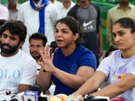 Wrestlers Vinesh Phogat (R), Sakshi Malik and Bajrang Punia during a press conference