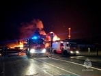 A view shows firefighting vehicles at the accident scene following an explosion at a gas station in the city of Makhachkala, Russia, August 14, 2023.