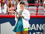 Jessica Pegula (USA) poses with her trophy after winning the singles final at IGA Stadium. Mandatory Credit