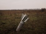 Russia-Ukraine War: An unexploded Grad rocket is embedded in a field, northwest of the city of Kherson, Ukraine.