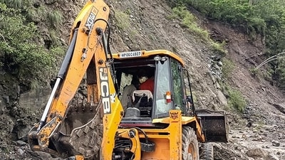 Himachal Pradesh Rain: A JCB machine clears the pile of debris after a landslide occurred due to incessant rains, in Rampur, Himachal Pradesh. (ANI) Himachal Pradesh Rain: A JCB machine clears the pile of debris after a landslide occurred due to incessant rains, in Rampur, Himachal Pradesh. (ANI)