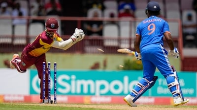 Nicholas Pooran stumps Sanju Samson during their second T20 (AP) Nicholas Pooran stumps Sanju Samson during their second T20 (AP)