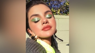 Give the simple green eye shadow look used by Deepika Padukone a shimmery twist in this glam inspired by Selena Gomez. Fill your upper eyelid with a light green eye shadow and top it off with shimmering glitter. Complement it with coral red lip shade, mascara, blush, and beaming highlighter. (Instagram) Give the simple green eye shadow look used by Deepika Padukone a shimmery twist in this glam inspired by Selena Gomez. Fill your upper eyelid with a light green eye shadow and top it off with shimmering glitter. Complement it with coral red lip shade, mascara, blush, and beaming highlighter. (Instagram)