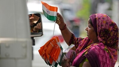 A roadside vendor sells tricolor flags at a traffic intersection ahead of India's Independence Day. (AP/Representative) A roadside vendor sells tricolor flags at a traffic intersection ahead of India's Independence Day. (AP/Representative)