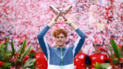 Jannik Sinner of Italy lifts the champions trophy after his win against Alex De Minaur of Australia in the Singles Final during Day Seven of the National Bank Open (Getty Images via AFP)