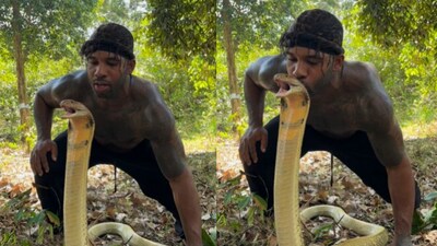 Snapshot of the man kissing the snake on its head. (Instagram/@MikeHolston)