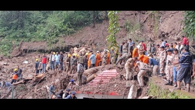 Rescue operations underway after a landslide hit a temple in Summerhill. (Deepak Sansta/HT)