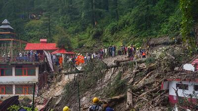 Rescuers at the scene of the landslide-hit temple in Shimla on Monday. (PTI) Rescuers at the scene of the landslide-hit temple in Shimla on Monday. (PTI)