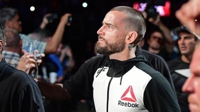 CM Punk entered the arena to his trademark music. (AP) CM Punk entered the arena to his trademark music. (AP)