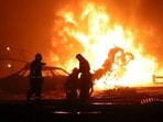 Firefighters work at the accident scene following an explosion at a gas station in the city of Makhachkala, Russia, in this handout picture published August 15, 2023. (Reuters)