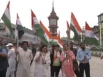 Group of people waving the national flag at Srinagar's Lal Chowk