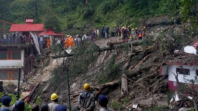 Rescue workers remove the debris as they search for survivors after a landslide following torrential rain in Shimla in the northern state of Himachal Pradesh, India, August 14, 2023. (Reuters)