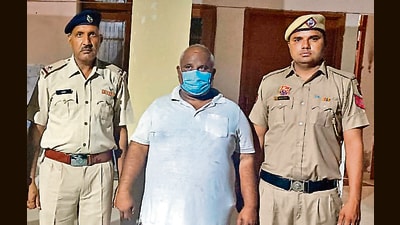 Bittu Bajrangi in police custody. Bittu Bajrangi in police custody.