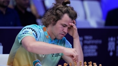 Norwegian Magnus Carlsen, left, of SG Alpine Warriors plays against Poland's Jan-Krzysztof Duda of Chingari Gulf Titans during Global Chess League in Dubai (AP) Norwegian Magnus Carlsen, left, of SG Alpine Warriors plays against Poland's Jan-Krzysztof Duda of Chingari Gulf Titans during Global Chess League in Dubai (AP)
