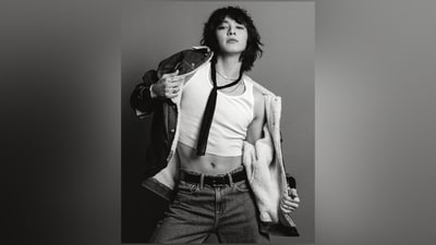 The last vignette also shows Jungkook embracing gender fluidity with absolute panache, dressed in a white crew-neck crop tank top, a denim jacket with faux fur lining, denim jeans, layered chains, a statement necktie, and his signature messy hairdo. (Instagram/@calvinklein) The last vignette also shows Jungkook embracing gender fluidity with absolute panache, dressed in a white crew-neck crop tank top, a denim jacket with faux fur lining, denim jeans, layered chains, a statement necktie, and his signature messy hairdo. (Instagram/@calvinklein)