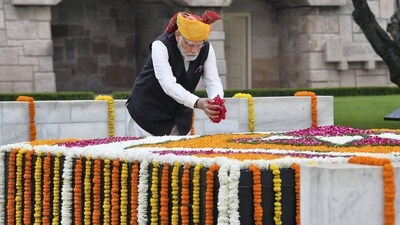 Prime Minister Narendra Modi pays floral tributes at the Samadhi of Mahatma Gandhi at Rajghat, on the occasion of the 77th Independence Day, in Delhi. (PTI Photo) Prime Minister Narendra Modi pays floral tributes at the Samadhi of Mahatma Gandhi at Rajghat, on the occasion of the 77th Independence Day, in Delhi. (PTI Photo)