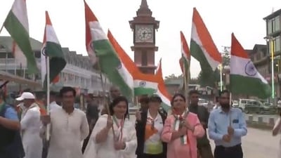 Group of people waving the national flag at Srinagar's Lal Chowk