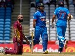West Indies' bowler Yannic Cariah watches India's batsmen Shubman Gill and Ishan Kishan (C) West Indies' bowler Yannic Cariah watches India's batsmen Shubman Gill and Ishan Kishan (C)