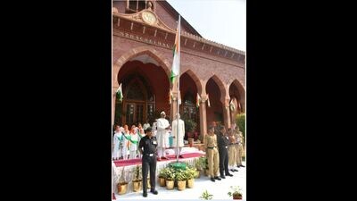 AMU VC hoisting bthe Tricolour (Sourced)