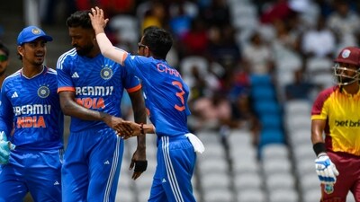 Ishan Kishan (L), Hardik Pandya (2L) and Yuzvendra Chahal (3L) of India celebrate the dismissal of Nicholas Pooran (R) of West Indies (AFP) Ishan Kishan (L), Hardik Pandya (2L) and Yuzvendra Chahal (3L) of India celebrate the dismissal of Nicholas Pooran (R) of West Indies (AFP)