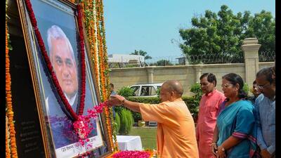 Chief minister Yogi Adityanath pays floral tribute to former Prime Minister Atal Bihari Vajpayee on his death anniversary, at Lok Bhawan in Lucknow Wednesday. (PTI Photo) Chief minister Yogi Adityanath pays floral tribute to former Prime Minister Atal Bihari Vajpayee on his death anniversary, at Lok Bhawan in Lucknow Wednesday. (PTI Photo)