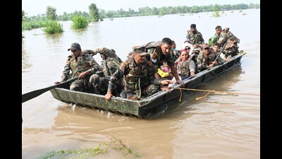 Rescue teams shift flood-effected people to a safer place in Gurdaspur on Wednesday. (HT photo) Rescue teams shift flood-effected people to a safer place in Gurdaspur on Wednesday. (HT photo)