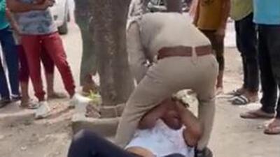 The video showed the cop in uniform severely slapping, punching and kicking a civilian who finally fell unconscious. (Video grab) The video showed the cop in uniform severely slapping, punching and kicking a civilian who finally fell unconscious. (Video grab)