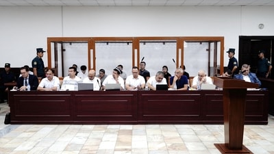Defendants and lawyers attend a court hearing in the case of child deaths linked to contaminated cough syrups, in Tashkent, Uzbekistan. (REUTERS)