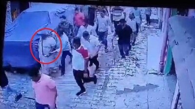 Plainclothed policemen after catching Bajrang Dal activist and cow vigilante Bittu Bajrangi on Tuesday.