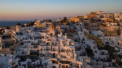 Oia, Santorini, Greece: You can watch a really beautiful sunset gently descending into the Aegean Sea from the caldera cliffs of Oia. Because of the stunning views and Greek surroundings, this sunset spot will be absolutely unforgettable. (Aris Messinis / AFP) Oia, Santorini, Greece: You can watch a really beautiful sunset gently descending into the Aegean Sea from the caldera cliffs of Oia. Because of the stunning views and Greek surroundings, this sunset spot will be absolutely unforgettable. (Aris Messinis / AFP)