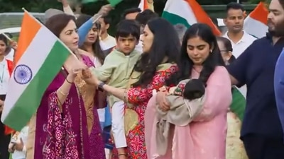 Nita Ambani handing the Indian flag to her grandson Prithvi. (Facebook/Reliance Industries Limited )