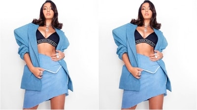 Her outfit comes in light blue and features an oversized blazer with full padded sleeves and a double collar. She accessorised with a chic black deep v-neck bralette for a sexy look. Paired with a matching mini skirt with an uneven hem, she looked like a true diva. (Instagram/@norafatehi) Her outfit comes in light blue and features an oversized blazer with full padded sleeves and a double collar. She accessorised with a chic black deep v-neck bralette for a sexy look. Paired with a matching mini skirt with an uneven hem, she looked like a true diva. (Instagram/@norafatehi)